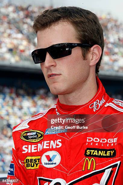 Kasey Kahne, driver of the Budweiser Dodge, prepares to climb into his car prior to the NASCAR Sprint Cup Series Gatorade Duel 1 at Daytona...