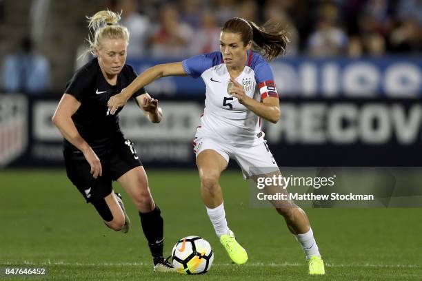 Betsy Hassett of New Zealand and Kelley O'Hara of the United States fight for control of the ball at Dick's Sporting Goods Park on September 15, 2017...