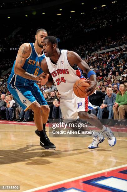 Antonio McDyess of the Detroit Pistons drives the ball against Tyson Chandler of the New Orleans Hornets during the game on January 17, 2009 at The...