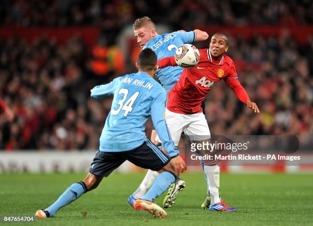 Manchester United's Ashley Young battles for the ball with Ajax's Ricardo Van Rhijn and Toby Alderweireld