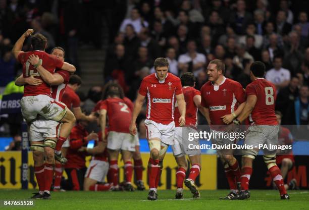 Wales' Rhys Priestland, who was sin-binned, looks dejected as his teammates celebrate victory during the RBS 6 Nations match at Twickenham, London.