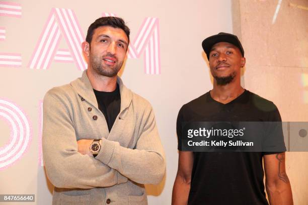 Golden State Warriors athletes Zaza Pachulia and David West pose for a photo at the Museum of Ice Cream opening party on September 15, 2017 in San...