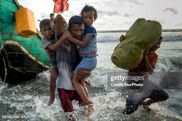 Myanmar Rohingya refugees are seen after arriving on a boat to Bangladesh on Shah Porir Dip Island Teknaf, Bangladesh 14 September 2017. According to...