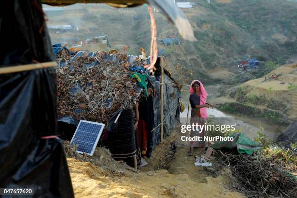 Rohingya woman stands close to her makeshift tent at the Balukhali camp in Ukhiya, Bangladesh 15 September 2017. Many of the Rohingya fleeing the...