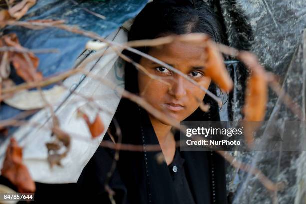 Rohingya child stands to her makeshift tent at the Balukhali camp in Ukhiya, Bangladesh 15 September 2017. Many of the Rohingya fleeing the violence...