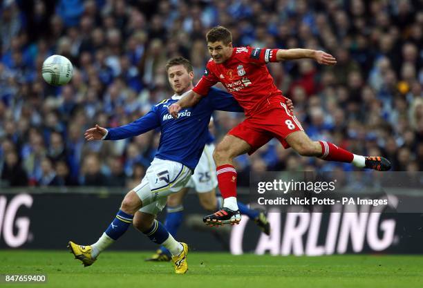 Liverpool's Steven Gerrard and Cardiff City's Aron Gunnarsson battle for the ball