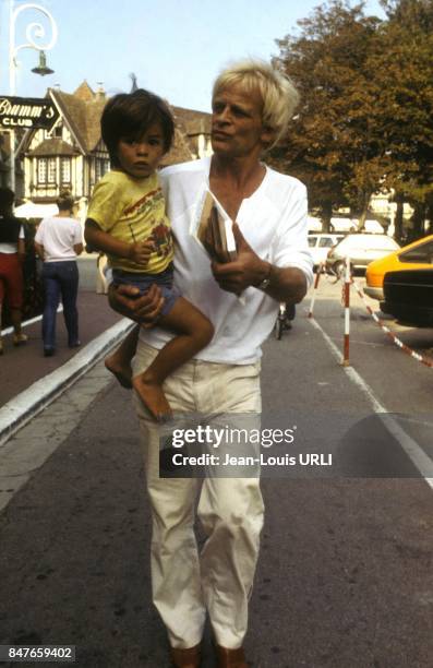 Klaus Kinski with son Nikolai circa 1980 in Deauville, France.