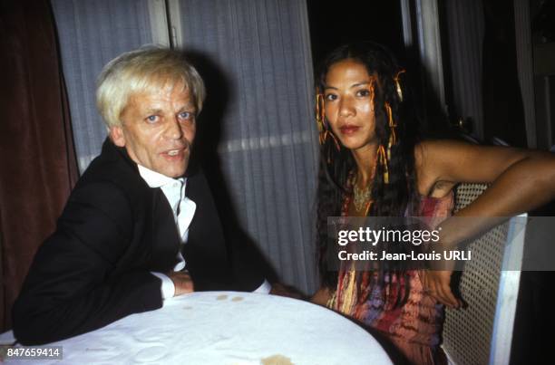 Klaus Kinski with wife Minhoi Genevieve Loanic circa 1980 in Deauville, France.