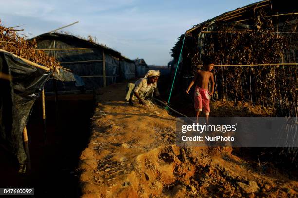 Rohingya child stands to her makeshift tent at the Balukhali camp in Ukhiya, Bangladesh 15 September 2017. Many of the Rohingya fleeing the violence...