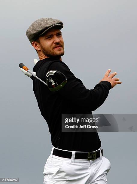 Justin Timberlake drops his club after hitting an errant tee shot on the sixth hole during the first round of the AT&T Pebble Beach National Pro-Am...