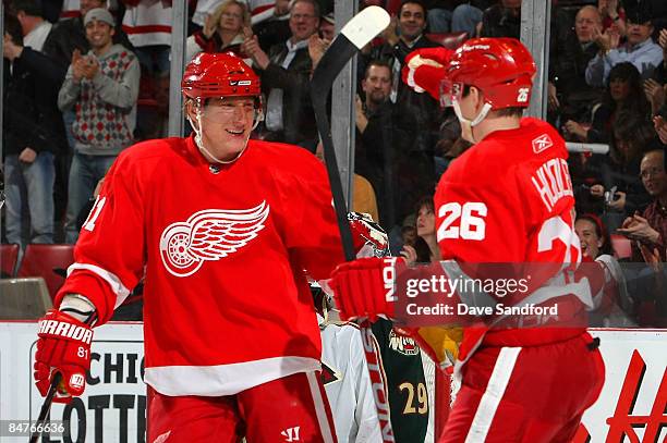 Jiri Hudler of the Detroit Red Wings celebrates his goal against the Minnesota Wild with teammate Marian Hossa during their NHL game at Joe Louis...