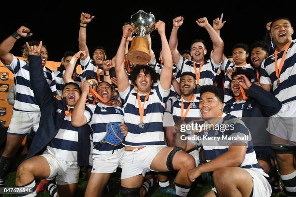 Auckland players celebrate with the Graham Mourie Cup after winning the Jock Hobbs Memorial Tournament match between Waikato and Auckland on...