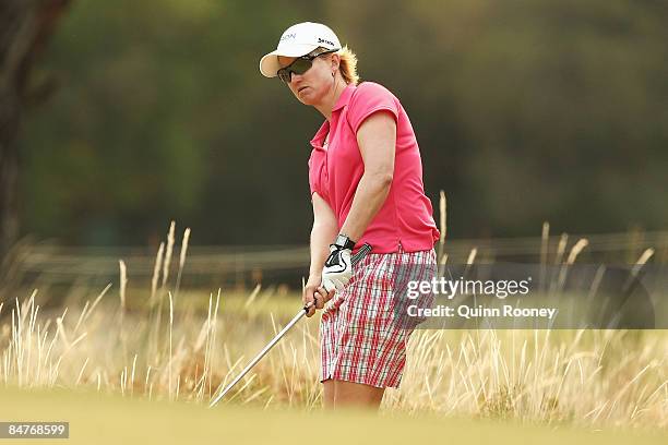 Karrie Webb of Australia plays out of the rough on the thirteenth hole during day two of the 2009 Women's Australian Open held at the Metropolitan...