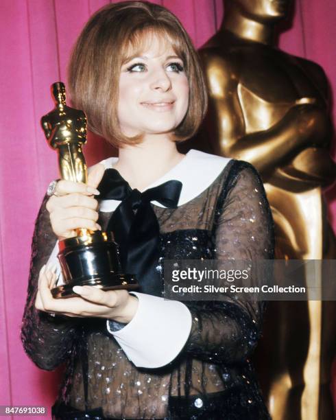 Singer and actress Barbra Streisand holds her Oscar for Best Actress won for the performance as Fanny Brice in the musical comedy-drama movie Funny...