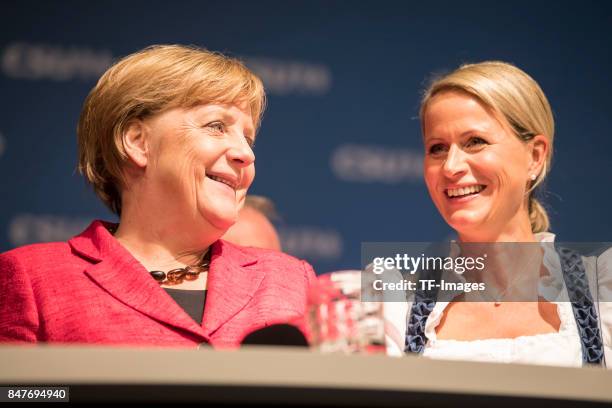 Angela Merkell and Claudia von Brauchitsch looks on during an election campaign stop on September 12, 2017 in Augsburg, Germany. Merkel is seeking a...