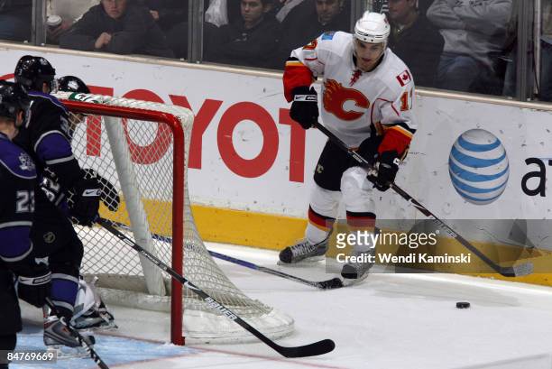 Rene Bourque of the Calgary Flames handles the puck behind the goal during a game against the Los Angeles Kings on February 12, 2009 at Staples...