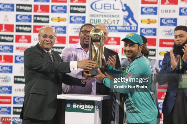 Pakistani batsman Ahmed Sehzad receives man of the match trophy from Chairman Pakistan Cricket board Najam Sethi. Ahamad sehzad scores 88 during the...