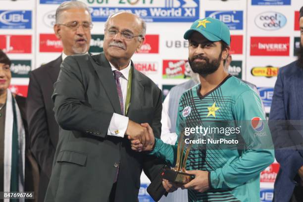 Pakistani batsman Ahmed Sehzad receives man of the match trophy from Chairman Pakistan Cricket board Najam Sethi. Ahamad Sehzad scores 88 during the...