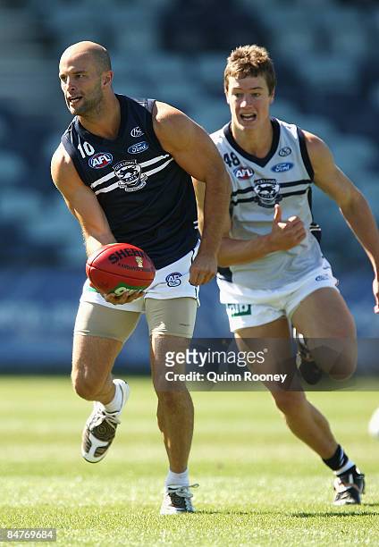 Tom Harley of the Cats handballs during a Geelong Cats Intra-Club Match at Skilled Stadium on February 13, 2009 in Melbourne, Australia.