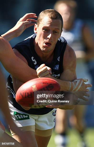 James Kelly of the Cats handballs during a Geelong Cats Intra-Club Match at Skilled Stadium on February 13, 2009 in Melbourne, Australia.