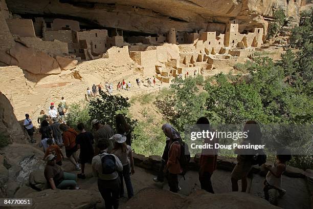 Visitors take a one hour, ticketed, ranger guided tour of Cliff Palace, Mesa Verde�s largest cliff dwelling, at Mesa Verde National Park on August 7,...