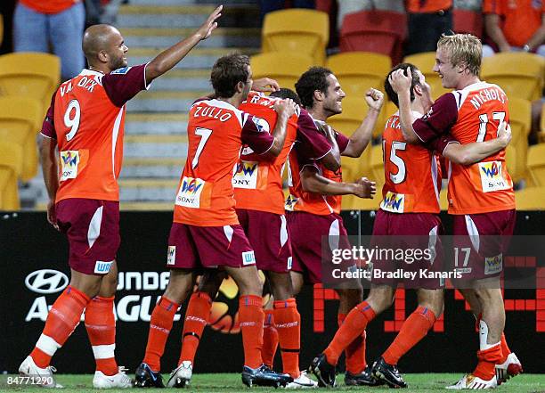 Mitchell Nichols of the Roar celebrates with team mates after scoring a goal during the minor semi final 2nd leg match between the Queensland Roar...