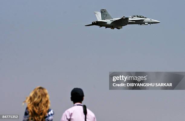 Navy F/A-18F Super Hornet flies past spectators at the Yelahanka Air Force Station during the third day of Aero India 2009 in Bangalore on February...
