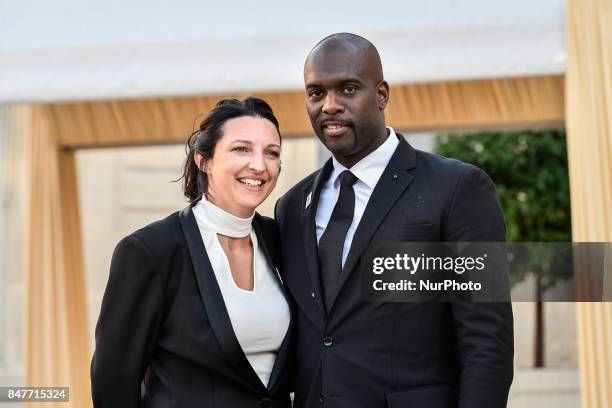 Ms and Mr Pascal Gentil arrive to celebrate Paris being announced as the host of the 2024 Olympics and Paralympics Games at the Elysee Palace on...