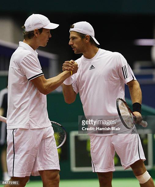 Tomas Berdych of Czech Republic and Jurgen Melzer of Austria celebrate victory their doubles quarterfinal match against Jeff Coetzee and Wesley...