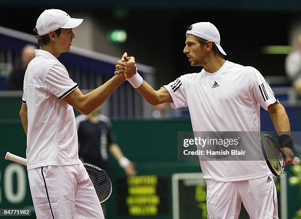 Tomas Berdych of Czech Republic and Jurgen Melzer of Austria celebrate victory their doubles quarterfinal match against Jeff Coetzee and Wesley...