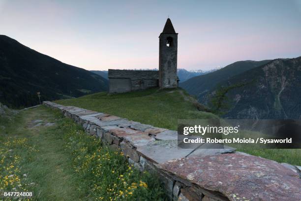 old church at dusk,  san romerio alp, switzerland - brusio grisons stock pictures, royalty-free photos & images