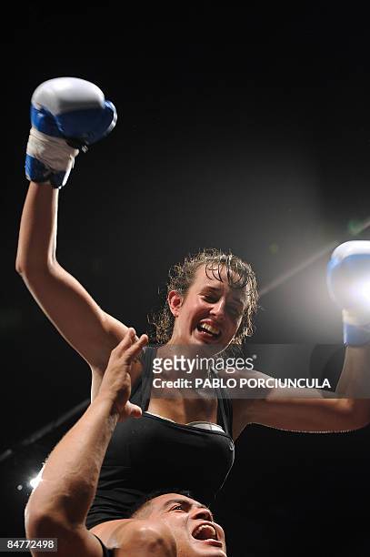Uruguayan world boxing champ Chris Namus celebrates after defeating Nicole Woods of the US compete in a super lightweight fight in Montevideo, early...