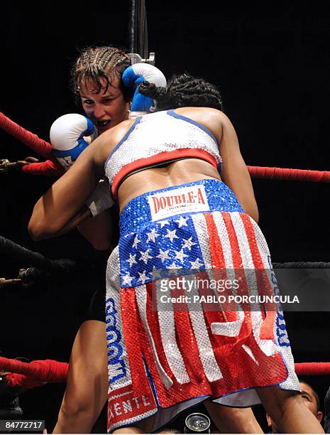 Uruguayan world boxing champ Chris Namus and Nicole Woods of the US compete during a super lightweight fight in Montevideo, early on February 13,...