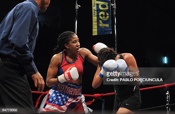 Uruguayan world boxing champ Chris Namus and Nicole Woods of the US compete during a super lightweight fight in Montevideo, early on February 13,...