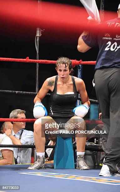 Uruguayan world boxing champ Chris Namus sits in her corner between rounds of the super lightweight fight against Nicole Woods of the US, in...
