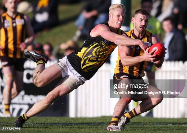 Steven Morris of the Tigers tackles Brendan Whitecross of the Hawks during the VFL Semi Final match between Box Hill and Richmond at Fortburn Stadium...