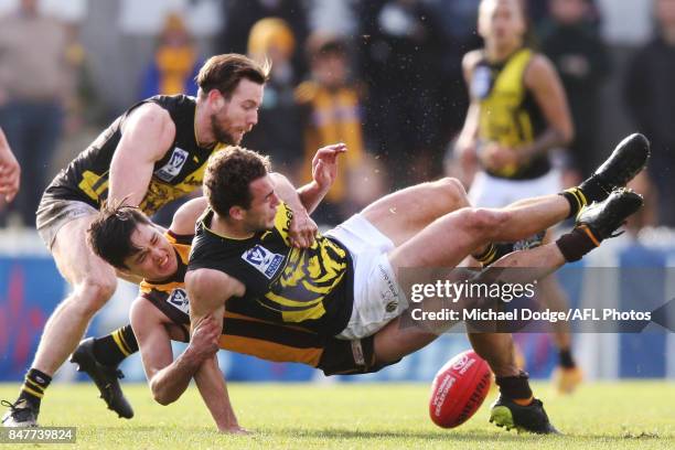 Joseph Fisher of the Hawks tackles Jacob Ballard of the Tigers during the VFL Semi Final match between Box Hill and Richmond at Fortburn Stadium on...