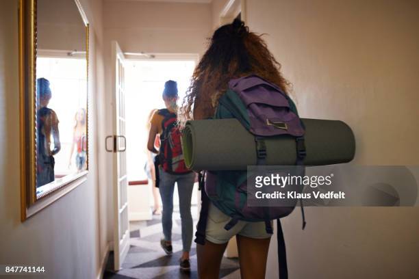 young women with backpacks, walking on isle of youth hostel - open day 3 stock pictures, royalty-free photos & images