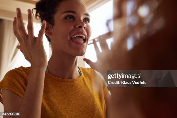 close-up young women talking, while sitting in bunk bed - mund stock-fotos und bilder