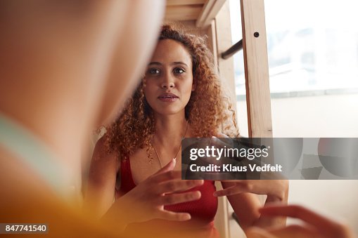 Close-up young women talking, while sitting in bunk bed Close-up young women talking, while sitting in bunk bed