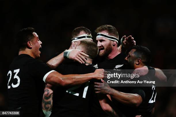 Kieran Read of the All Blacks celebrates with teammates on Lima Sopoaga's try during the Rugby Championship match between the New Zealand All Blacks...