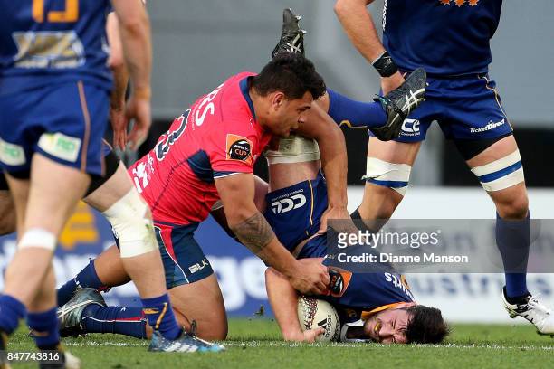 Adam Knight of Otago is tackled by Levi Aumua of Tasman during the round five Mitre 10 Cup match between Otago and Tasman Forsyth Barr Stadium on...