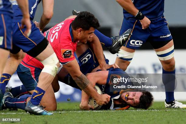 Adam Knight of Otago is tackled by Levi Aumua of Tasman during the round five Mitre 10 Cup match between Otago and Tasman Forsyth Barr Stadium on...