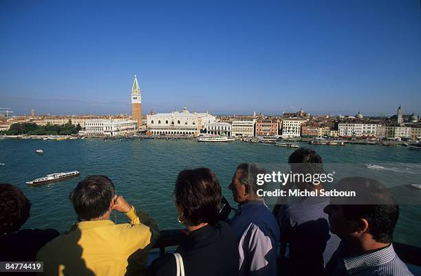 Traveling on a cruise boat the Campanile San Marco Bell Tower and Ducal Palace in front of Giudecca Canal on January 15, 2009 in Venice, Italy.