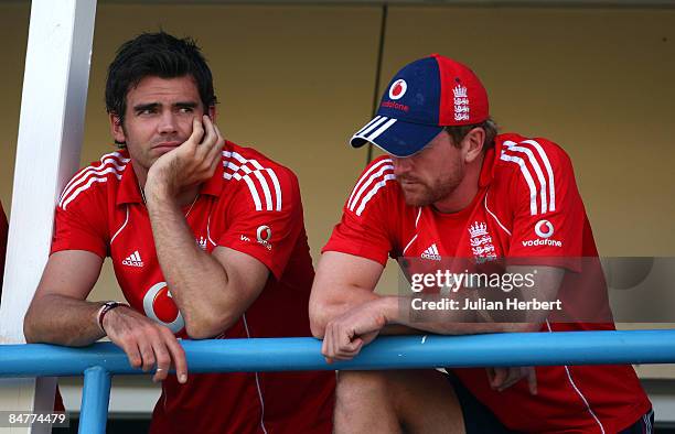 James Anderson and Paul collingwood of England waits to hear the decision of officals about the state of the pitch before the abandonment of day one...