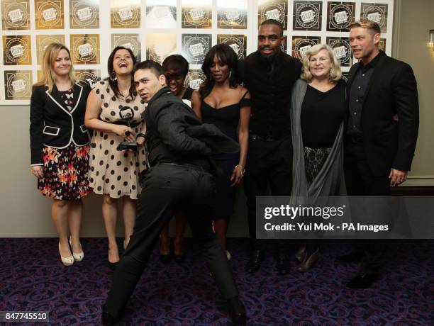 EastEnders cast members Ricky Norwood, Jo Joyner, Nina Wadia, Diane Parish and John Partridge with their TV Soap of the Year award during the...