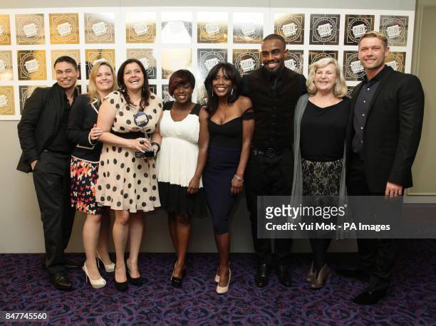EastEnders cast members Ricky Norwood, Jo Joyner, Nina Wadia, Diane Parish and John Partridge with their TV Soap of the Year award during the...