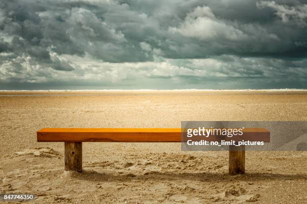 empty bench at the beach - wooden bench stock pictures, royalty-free photos & images
