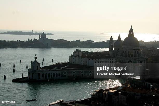View of Santa Maria della Salute church at the entrance of the Grand Canal and Giudecca Canal, in the backgroud Guidcca island and the Redentore...