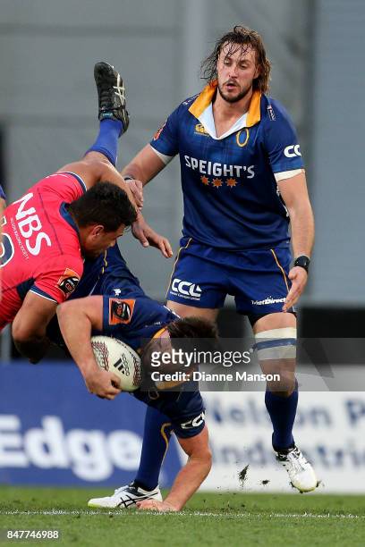 Adam Knight of Otago is tackled by Levi Aumua of Tasman during the round five Mitre 10 Cup match between Otago and Tasman Forsyth Barr Stadium on...